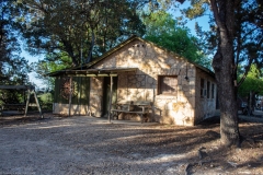 Outdoor view of cabins at sunset.