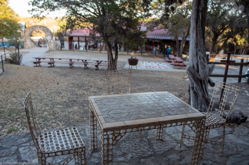 Outdoor table overlooking ranch festivities.