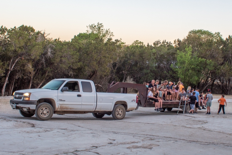 Guests loading up on a hay ride to the marshmellow roast.