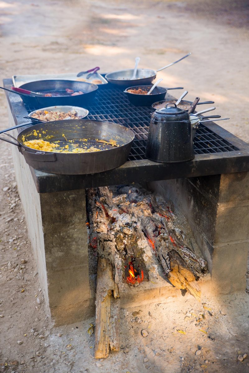 eggs and coffee cooking on a fire pit