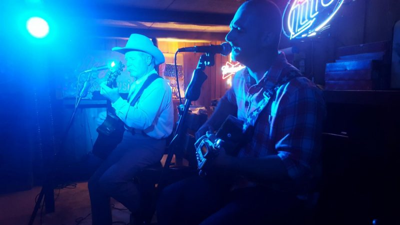 Cowboys performing in a band