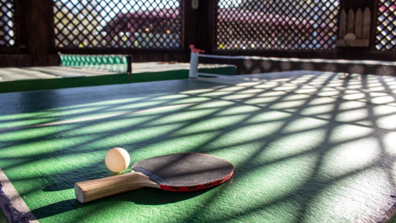 Ping pong table with paddle and ball